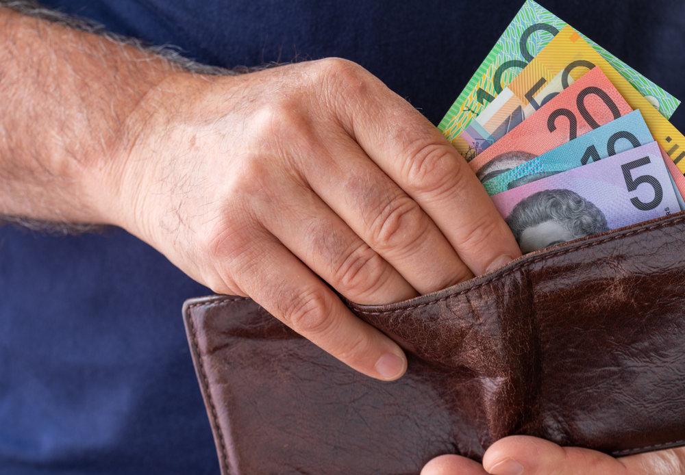 Male,Hand,Taking,Australian,Bank,Notes,From,A,Worn,Brown